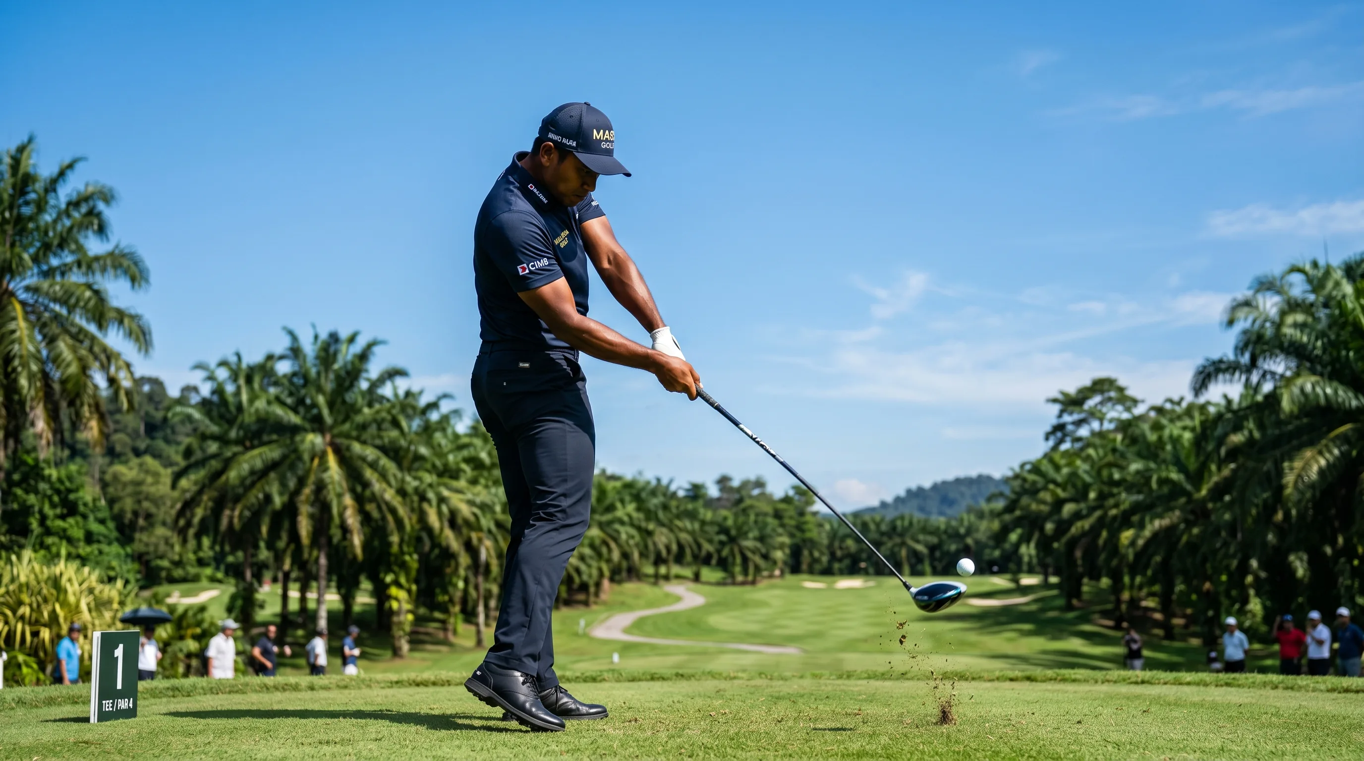 A Malaysian golfer driving powerfully off the tee against a clear sky, evoking Sabah's Nicholas Fung